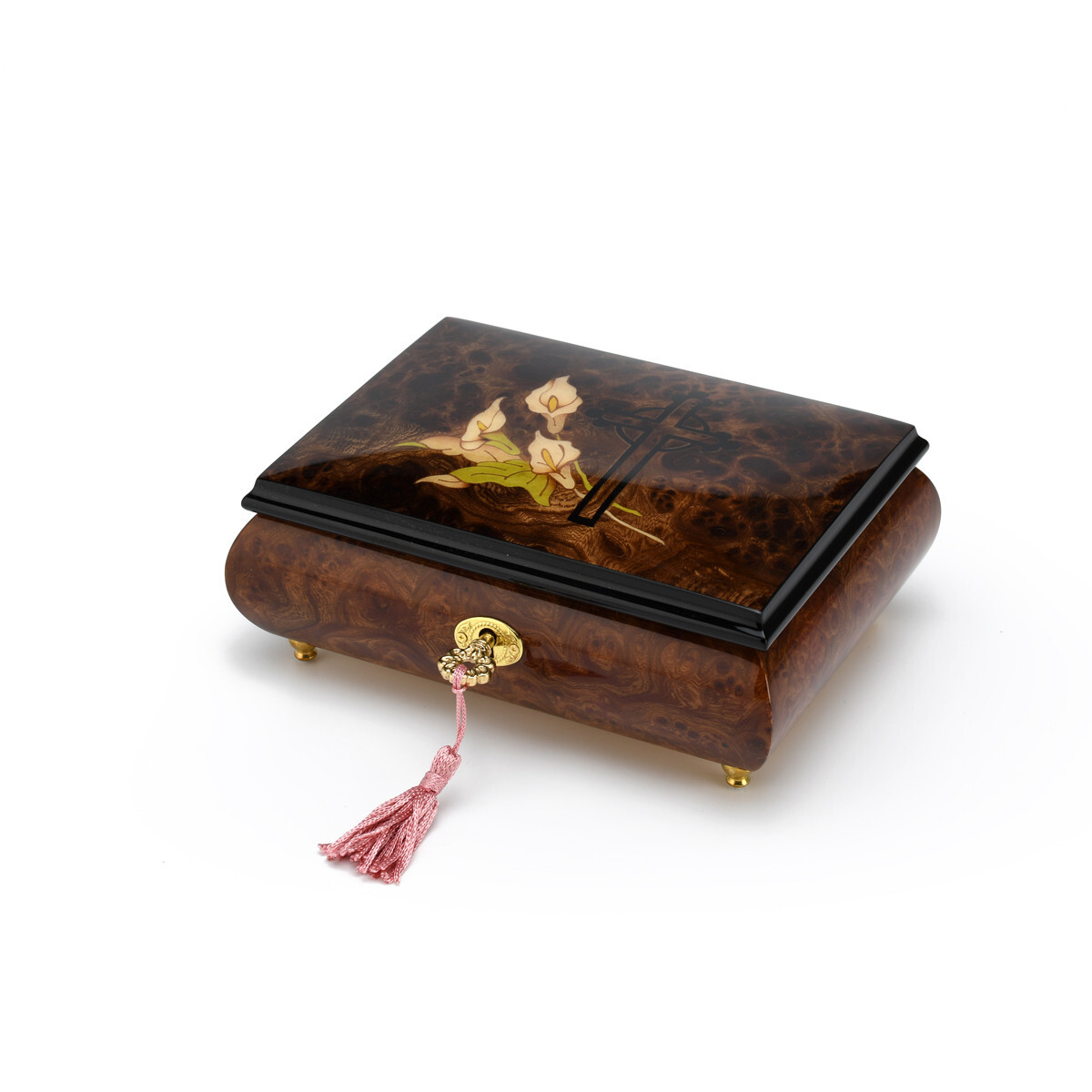 calla lilies and a cross on a music box