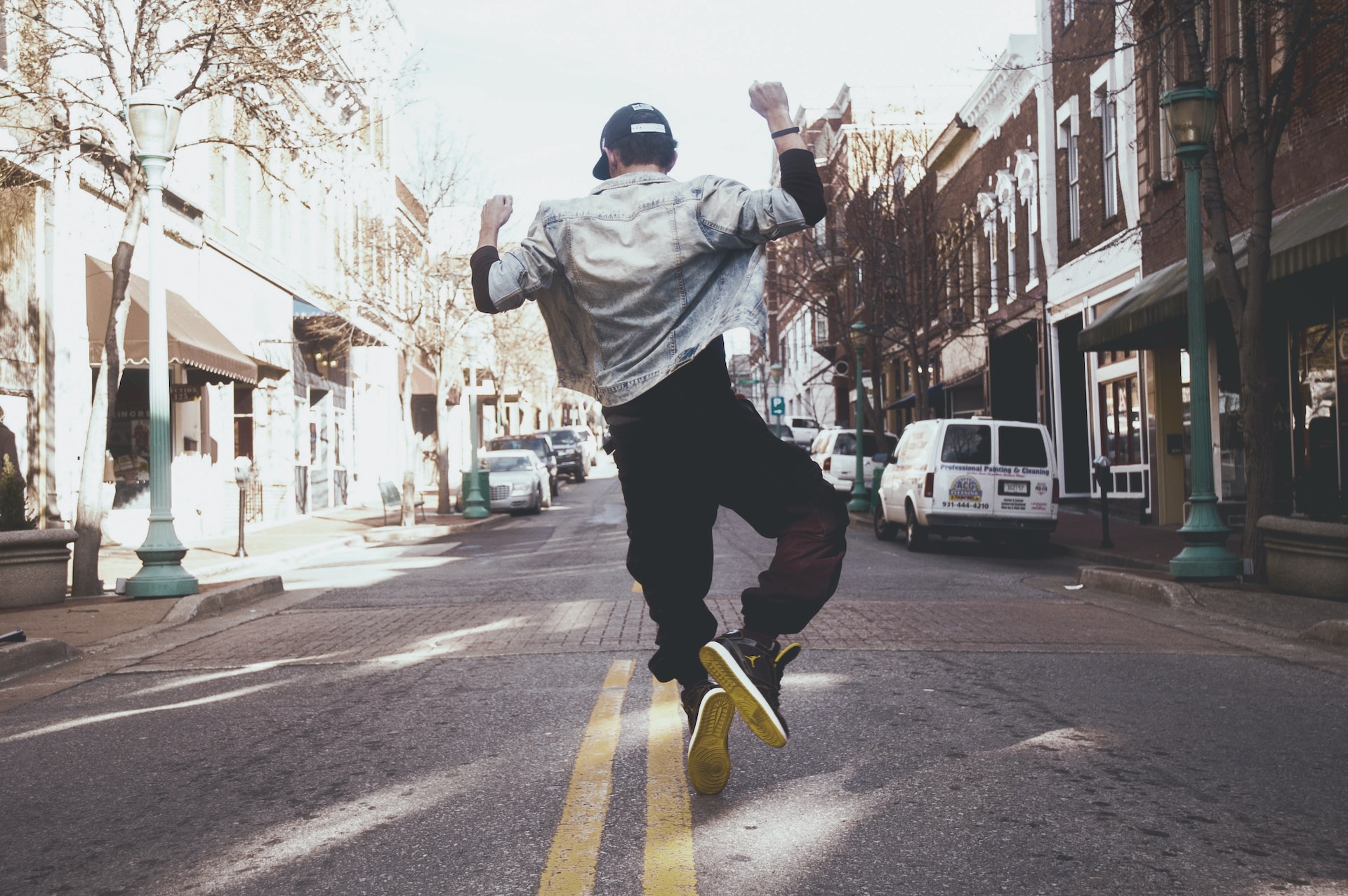  jumping for joy on the sidewalk
